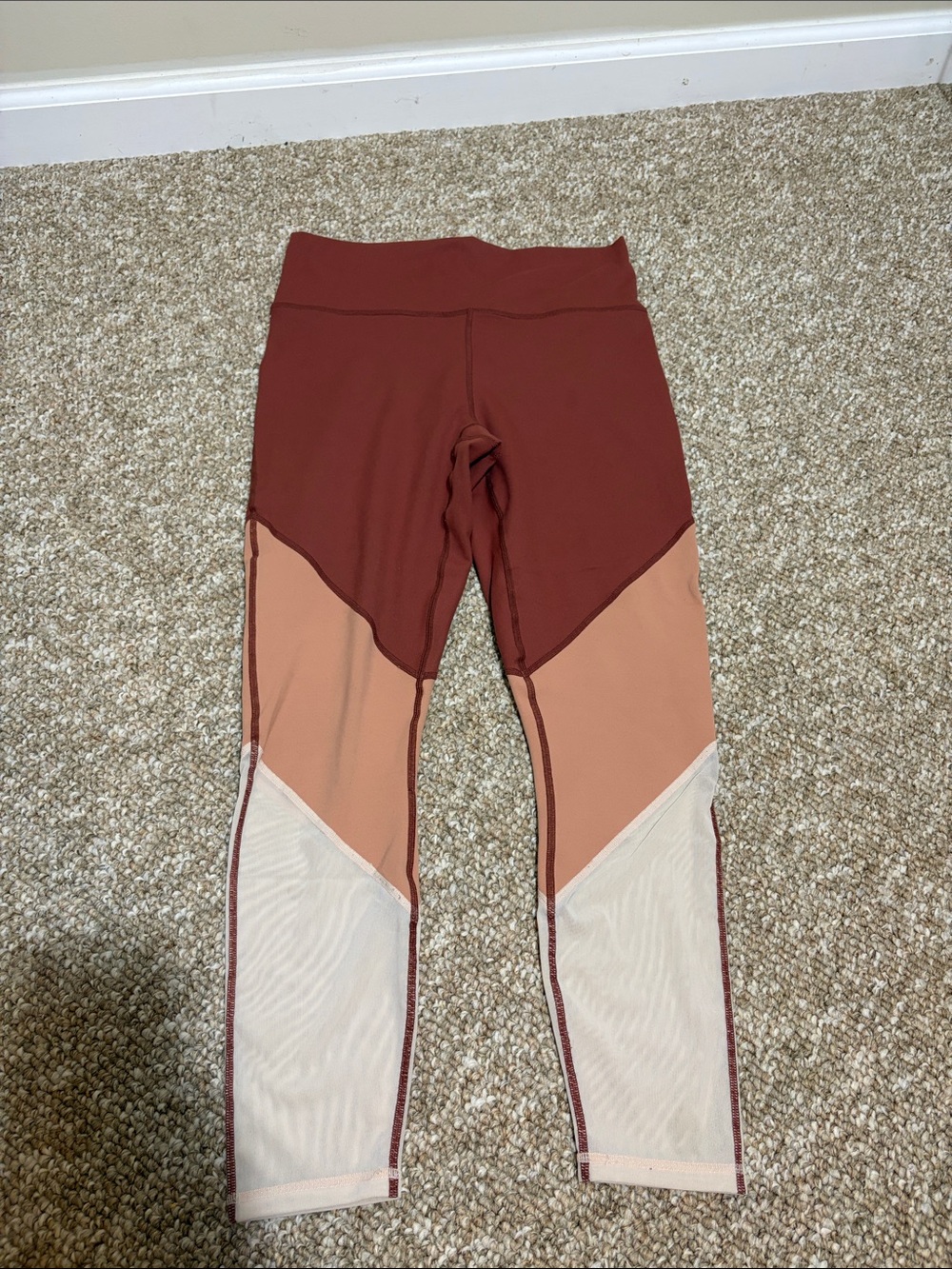 Fabletics' Colorblock Leggings in Rust and Peach